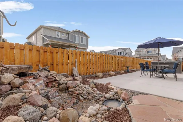 a view of a chairs and table in the patio