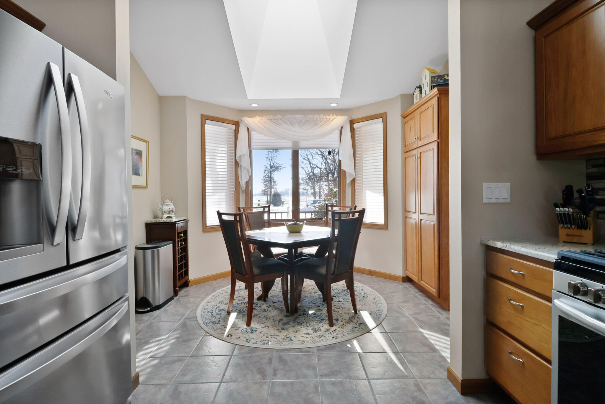 10030 Eagle Court Demotte, IN 46310 - Photo 10 of 49 a view of a dining room with furniture window and outside view
