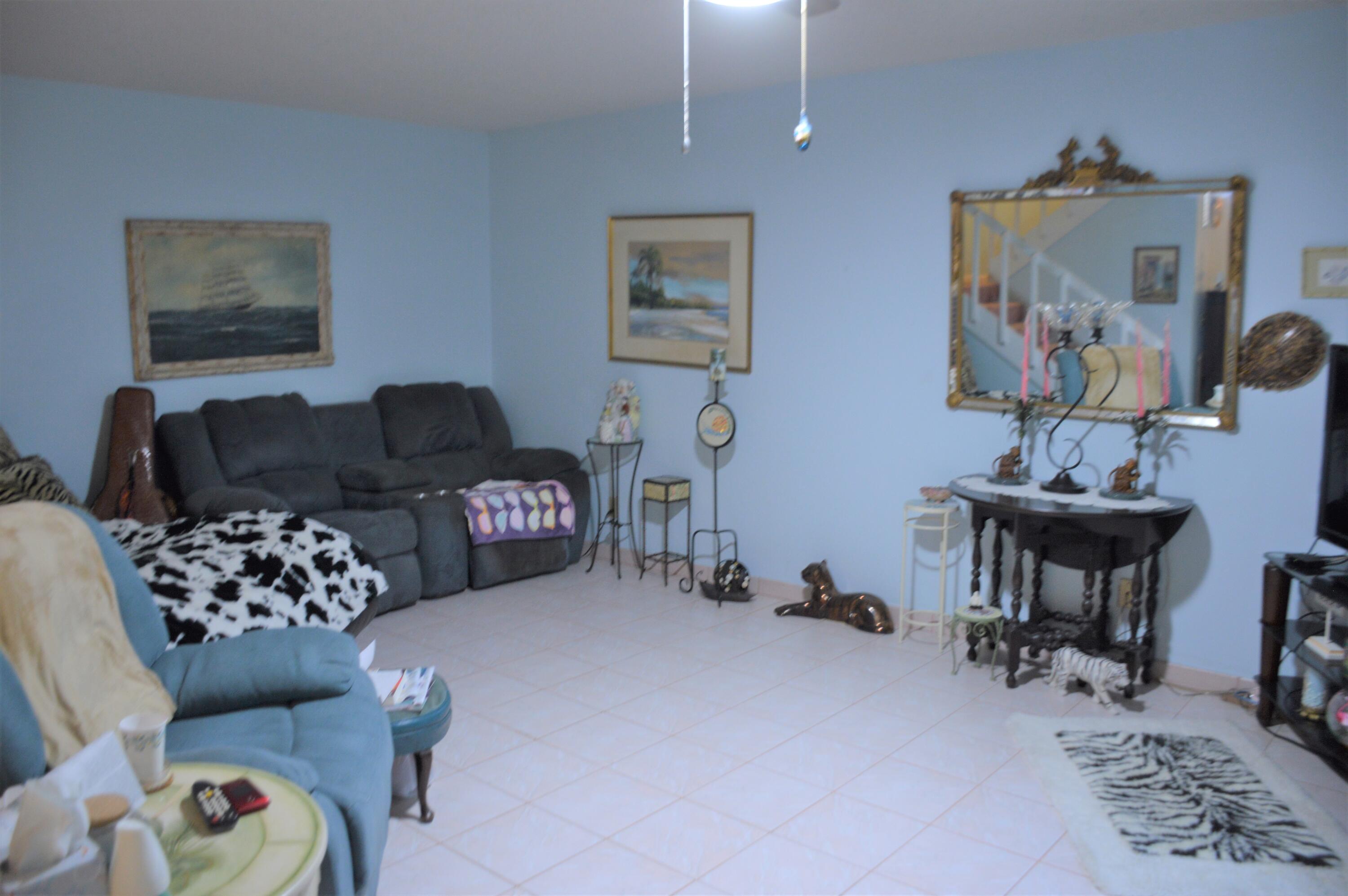 2936 Kirk Road Lake Worth, FL 33461 - Photo 12 of 23 a living room with furniture and a couch