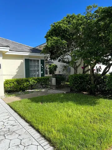 a view of a back yard from a balcony