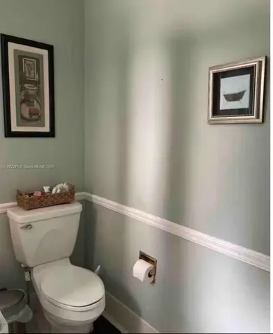 a view of a swimming pool with a table and chairs