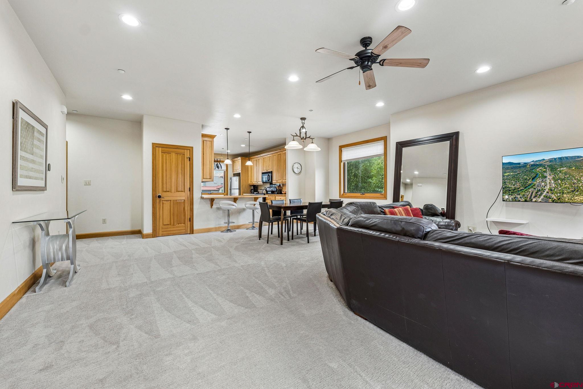 1422 Animas View Drive, Unit 55 Durango, CO 81301 - Photo 5 of 44 a living room with furniture and a large window