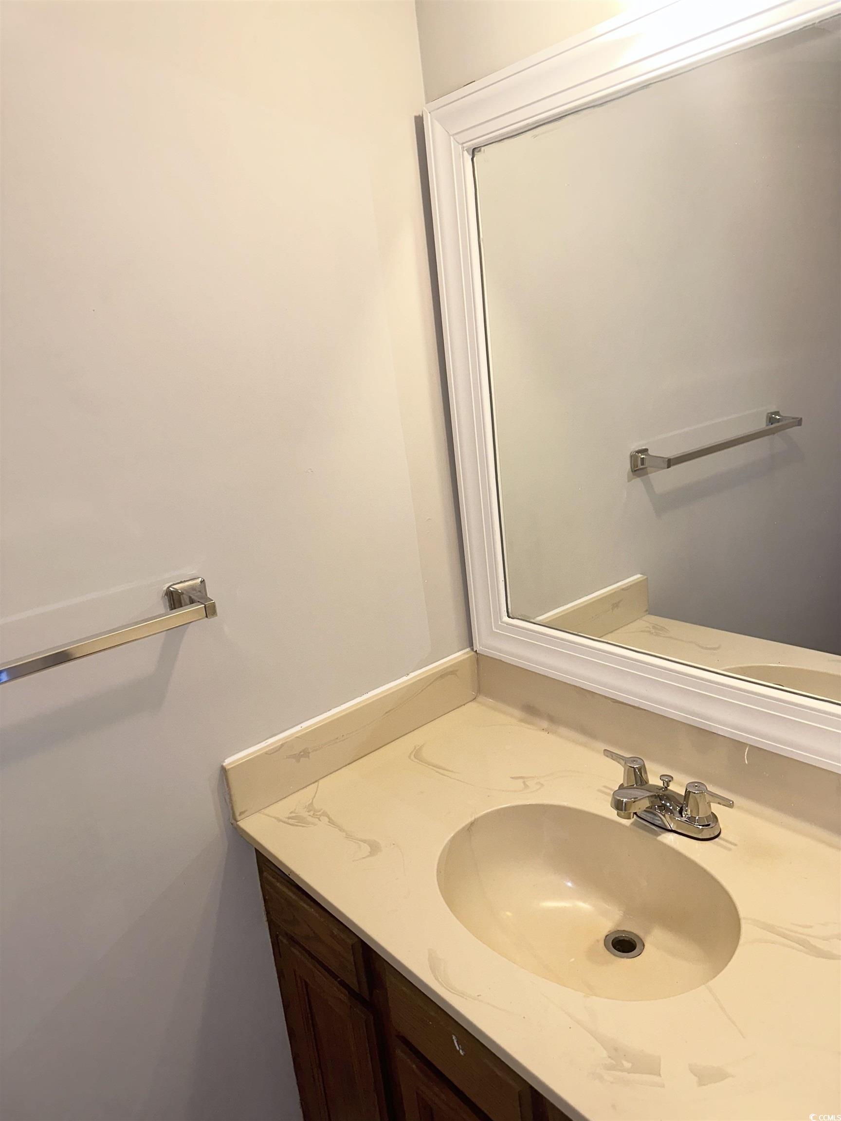 401 Garden Drive, Unit 100B Myrtle Beach, SC 29575 - Photo 11 of 23 Bathroom featuring vanity