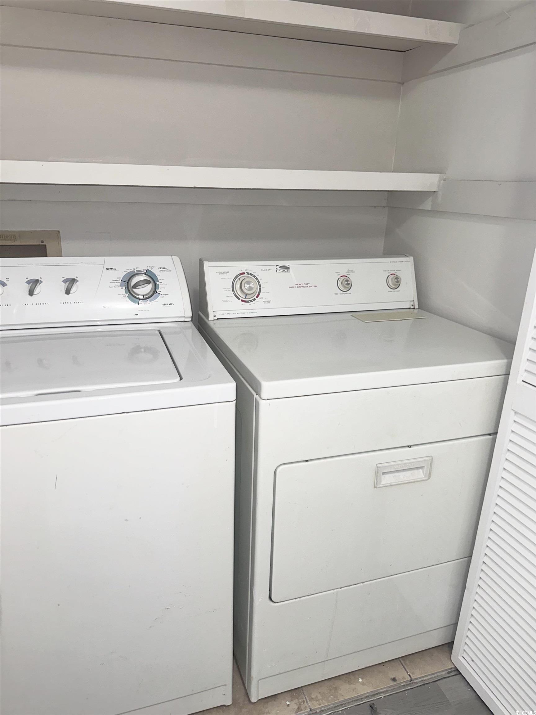 401 Garden Drive, Unit 100B Myrtle Beach, SC 29575 - Photo 17 of 23 Washroom featuring washing machine and dryer
