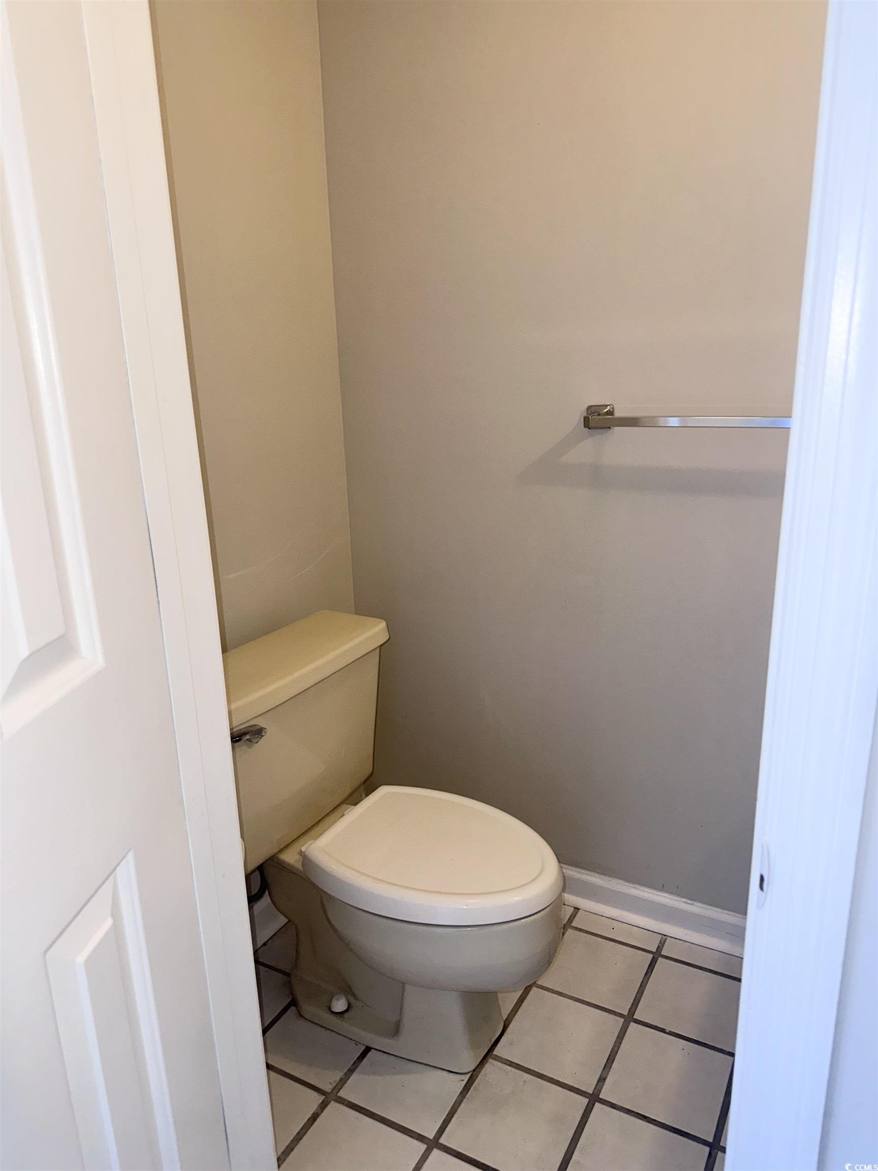 401 Garden Drive, Unit 100B Myrtle Beach, SC 29575 - Photo 10 of 23 Bathroom featuring toilet and tile patterned floors