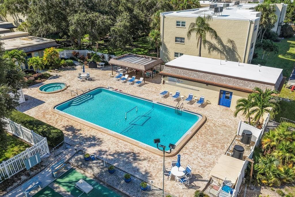 11485 Oakhurst Road, Unit 200208 Largo, FL 33774 - Photo 2 of 25 an aerial view of a house with outdoor space