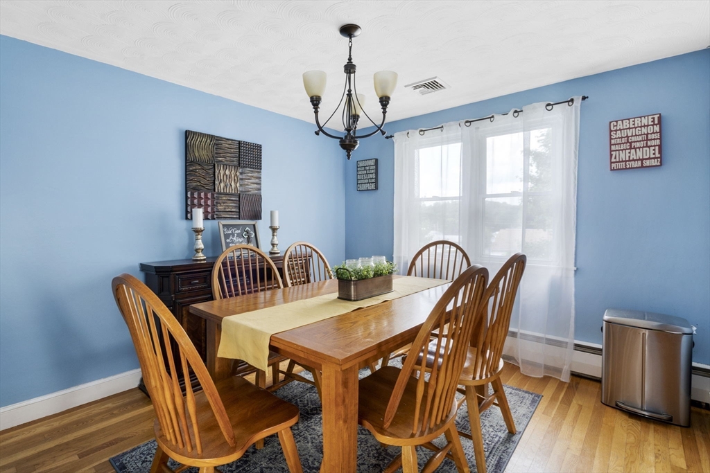 27 Raylen Avenue Peabody, MA 01960 - Photo 16 of 42 a view of a dining room with furniture window and wooden floor