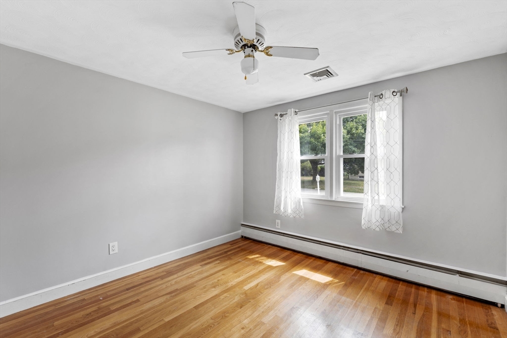 27 Raylen Avenue Peabody, MA 01960 - Photo 18 of 42 a view of empty room with wooden floor and fan