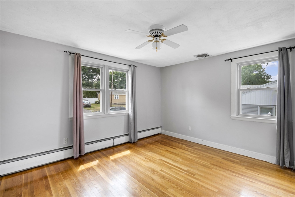 27 Raylen Avenue Peabody, MA 01960 - Photo 19 of 42 a view of empty room with wooden floor and fan