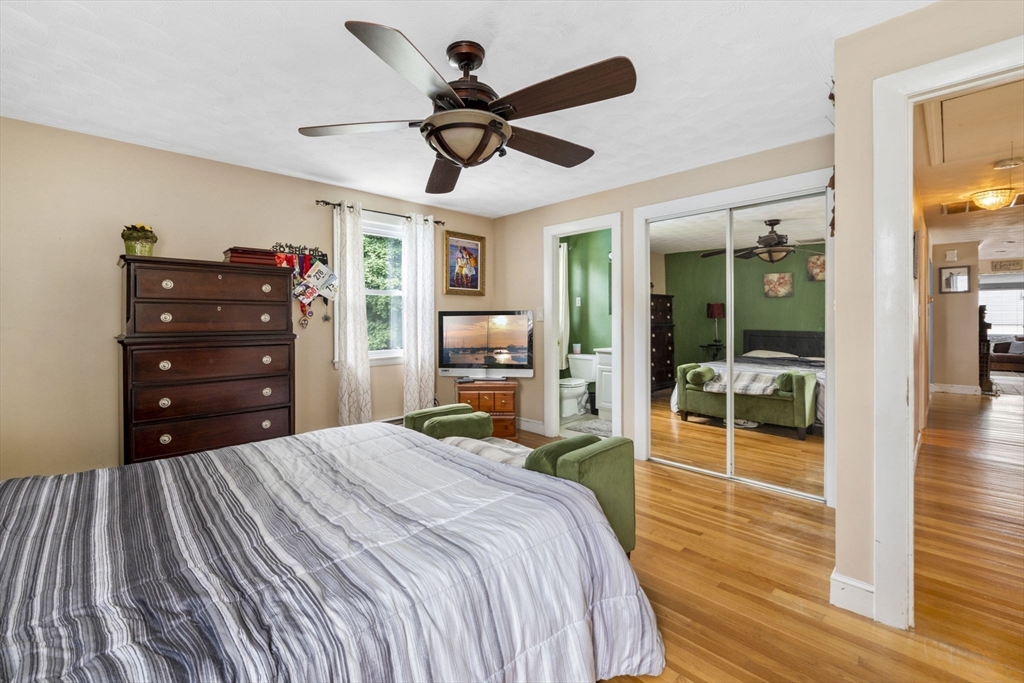 27 Raylen Avenue Peabody, MA 01960 - Photo 20 of 42 a bedroom with a bed and a chandelier