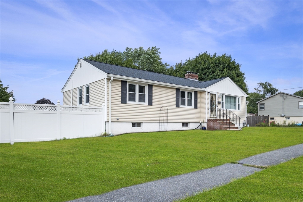 27 Raylen Avenue Peabody, MA 01960 - Photo 2 of 42 a front view of a house with a garden and yard