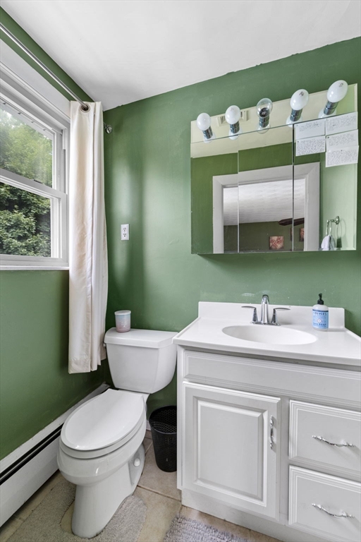 27 Raylen Avenue Peabody, MA 01960 - Photo 22 of 42 a bathroom with a toilet sink and mirror