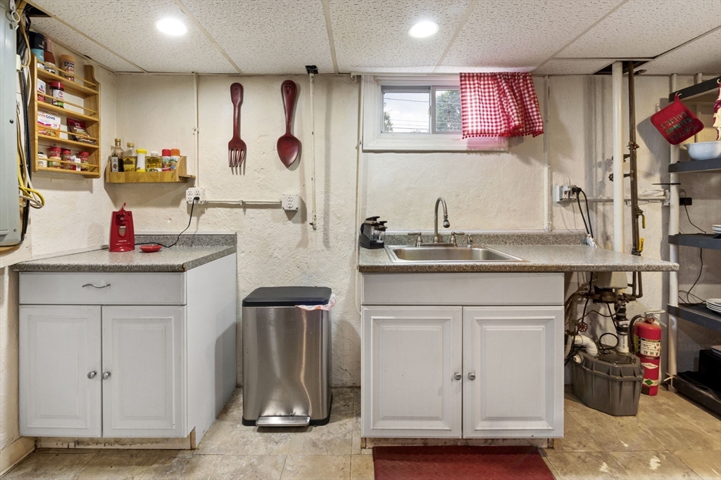 27 Raylen Avenue Peabody, MA 01960 - Photo 25 of 42 a kitchen with refrigerator and cabinets