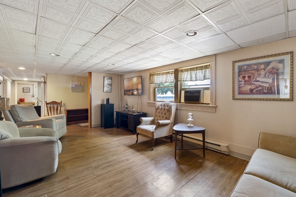 27 Raylen Avenue Peabody, MA 01960 - Photo 27 of 42 a living room with furniture and wooden floor