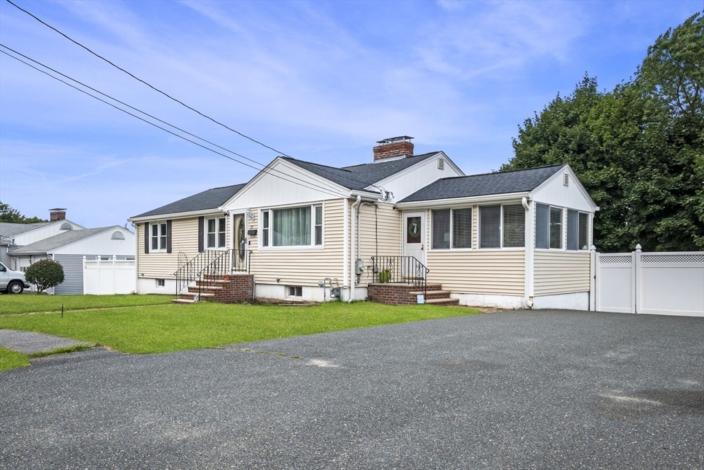 27 Raylen Avenue Peabody, MA 01960 - Photo 3 of 42 a front view of a house with a yard and porch