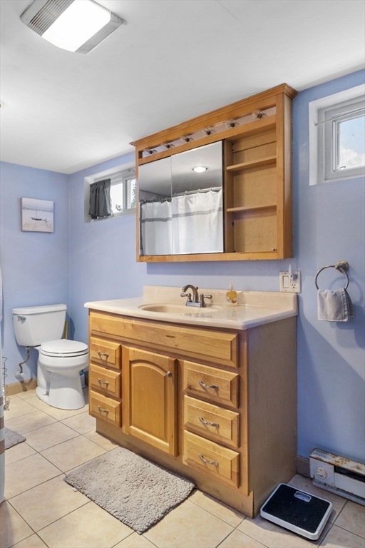27 Raylen Avenue Peabody, MA 01960 - Photo 31 of 42 a spacious bathroom with a sink and a mirror
