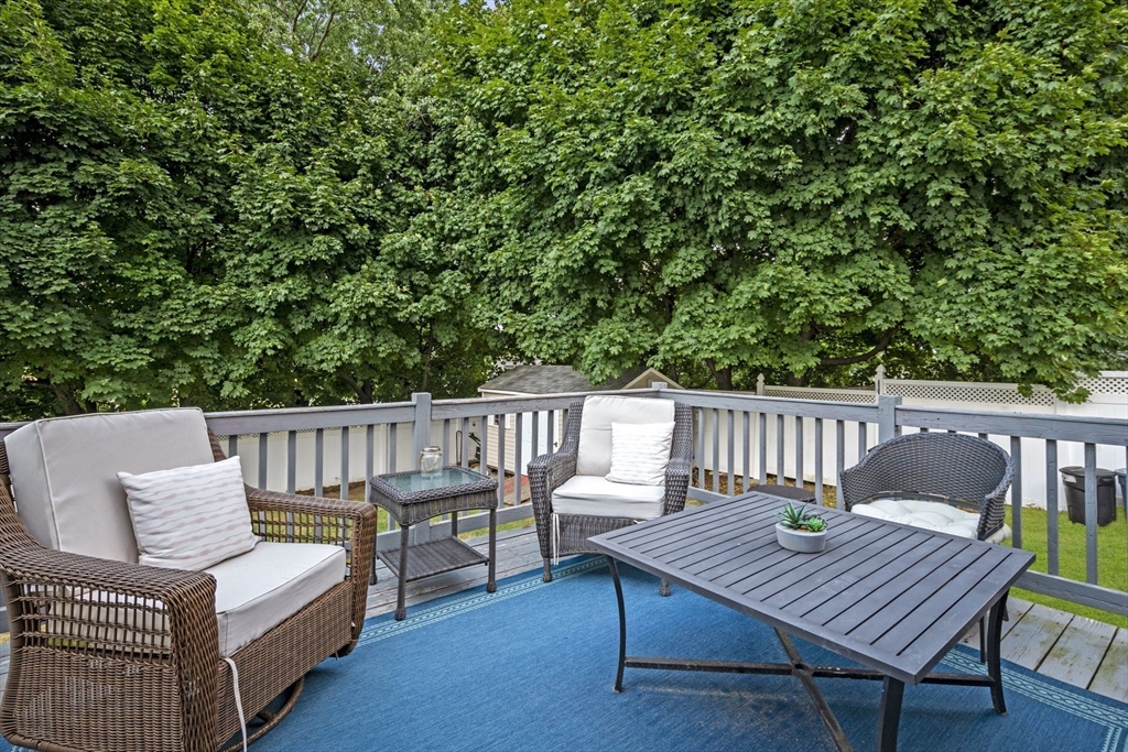 27 Raylen Avenue Peabody, MA 01960 - Photo 36 of 42 a view of a wooden chairs on the deck