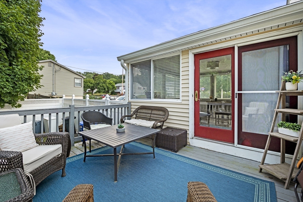27 Raylen Avenue Peabody, MA 01960 - Photo 37 of 42 a balcony with furniture and wooden floor