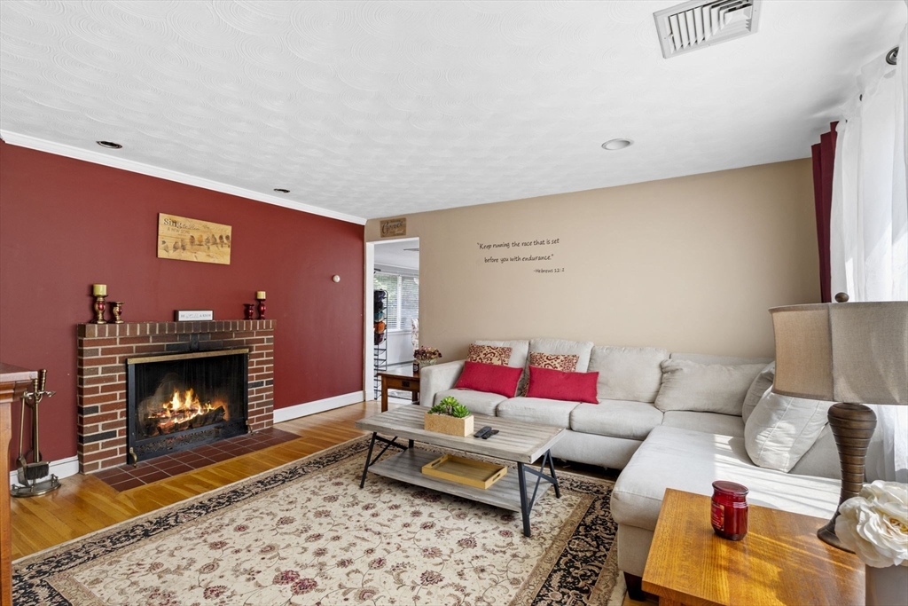 27 Raylen Avenue Peabody, MA 01960 - Photo 5 of 42 a living room with furniture and a fireplace