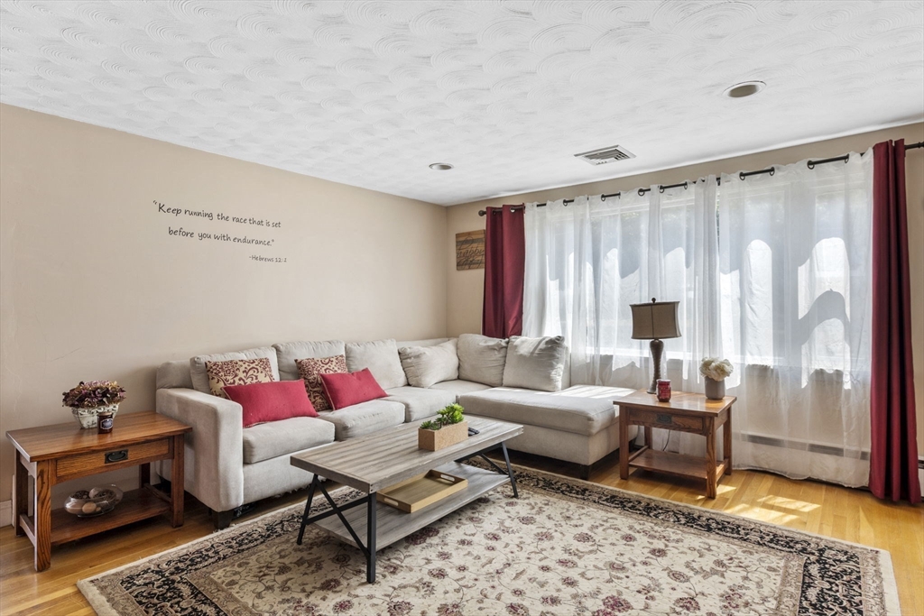 27 Raylen Avenue Peabody, MA 01960 - Photo 6 of 42 a living room with furniture and a rug