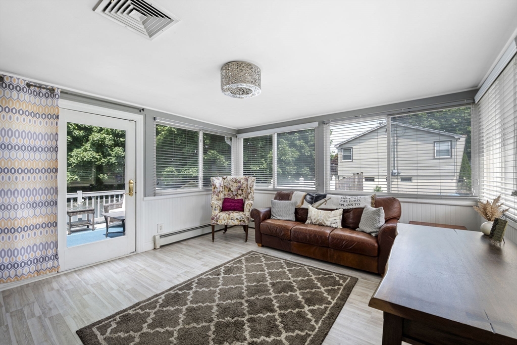 27 Raylen Avenue Peabody, MA 01960 - Photo 8 of 42 a living room with furniture and a large window