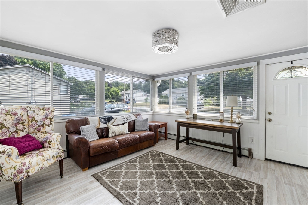 27 Raylen Avenue Peabody, MA 01960 - Photo 10 of 42 a living room with furniture and a large window