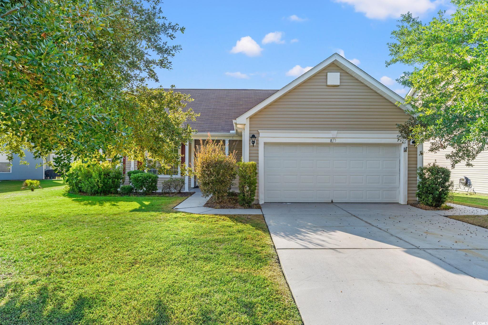875 Brookline Drive Myrtle Beach, SC 29579 - Photo 2 of 40 View of front of property featuring driveway, a front lawn, a garage, and roof with shingles