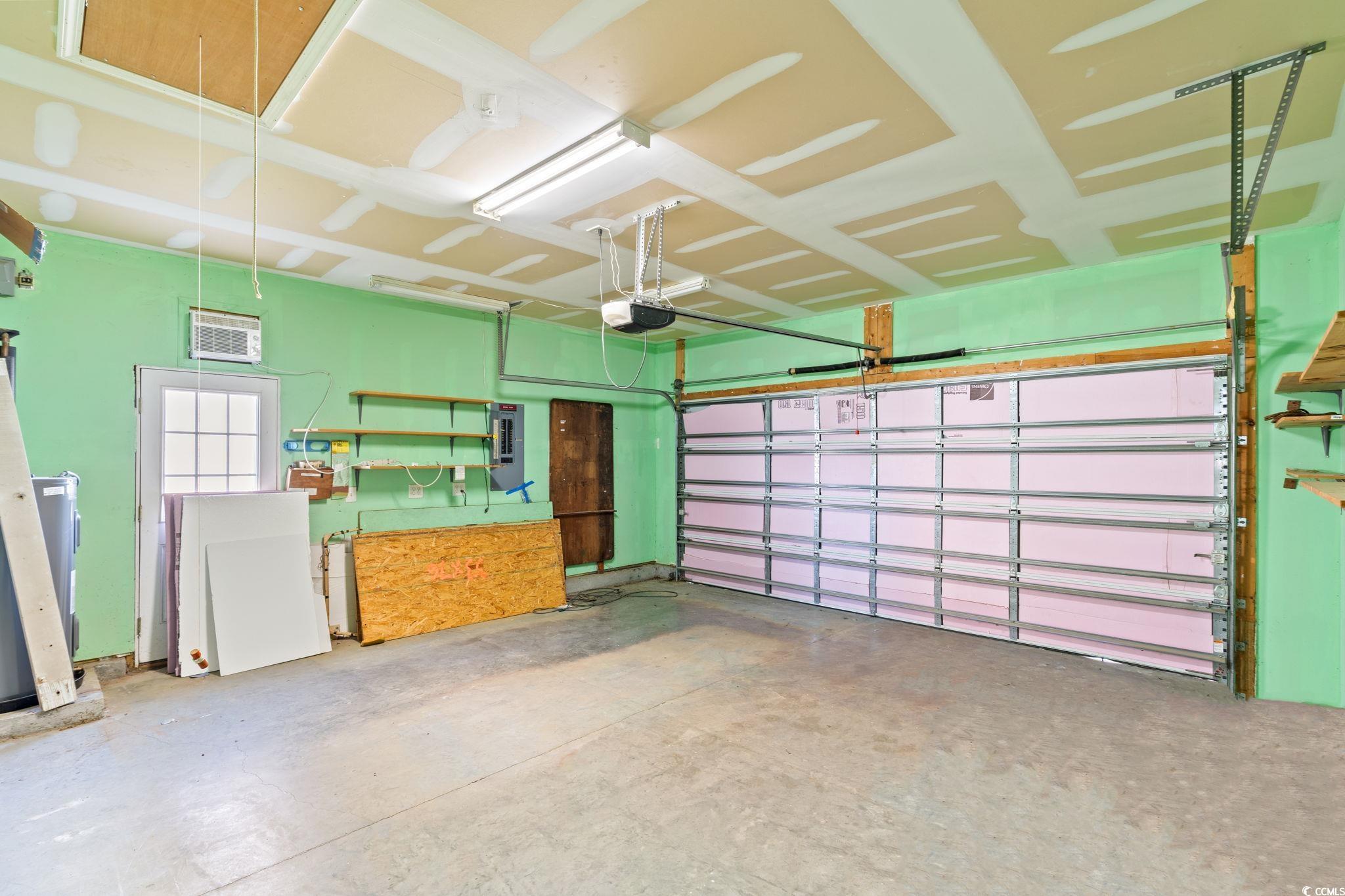 875 Brookline Drive Myrtle Beach, SC 29579 - Photo 25 of 40 Garage with electric panel and a garage door opener