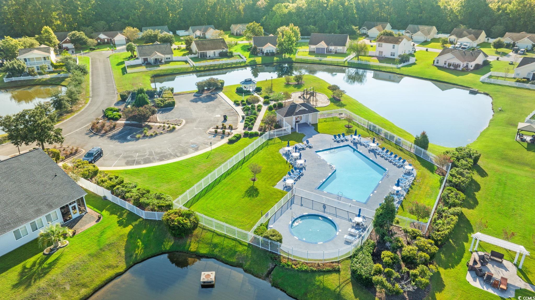 875 Brookline Drive Myrtle Beach, SC 29579 - Photo 35 of 40 Aerial perspective of suburban area featuring a large body of water and a pool area