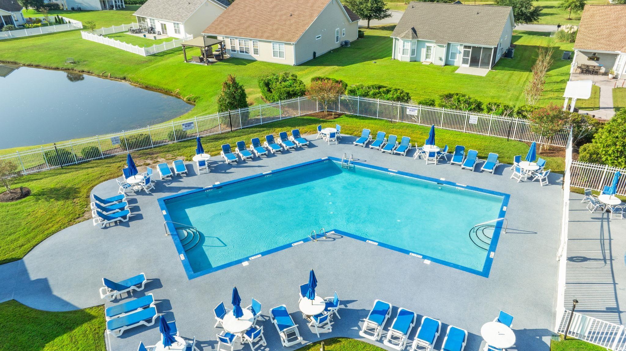 875 Brookline Drive Myrtle Beach, SC 29579 - Photo 37 of 40 Community pool featuring a patio, a water view, and a residential view