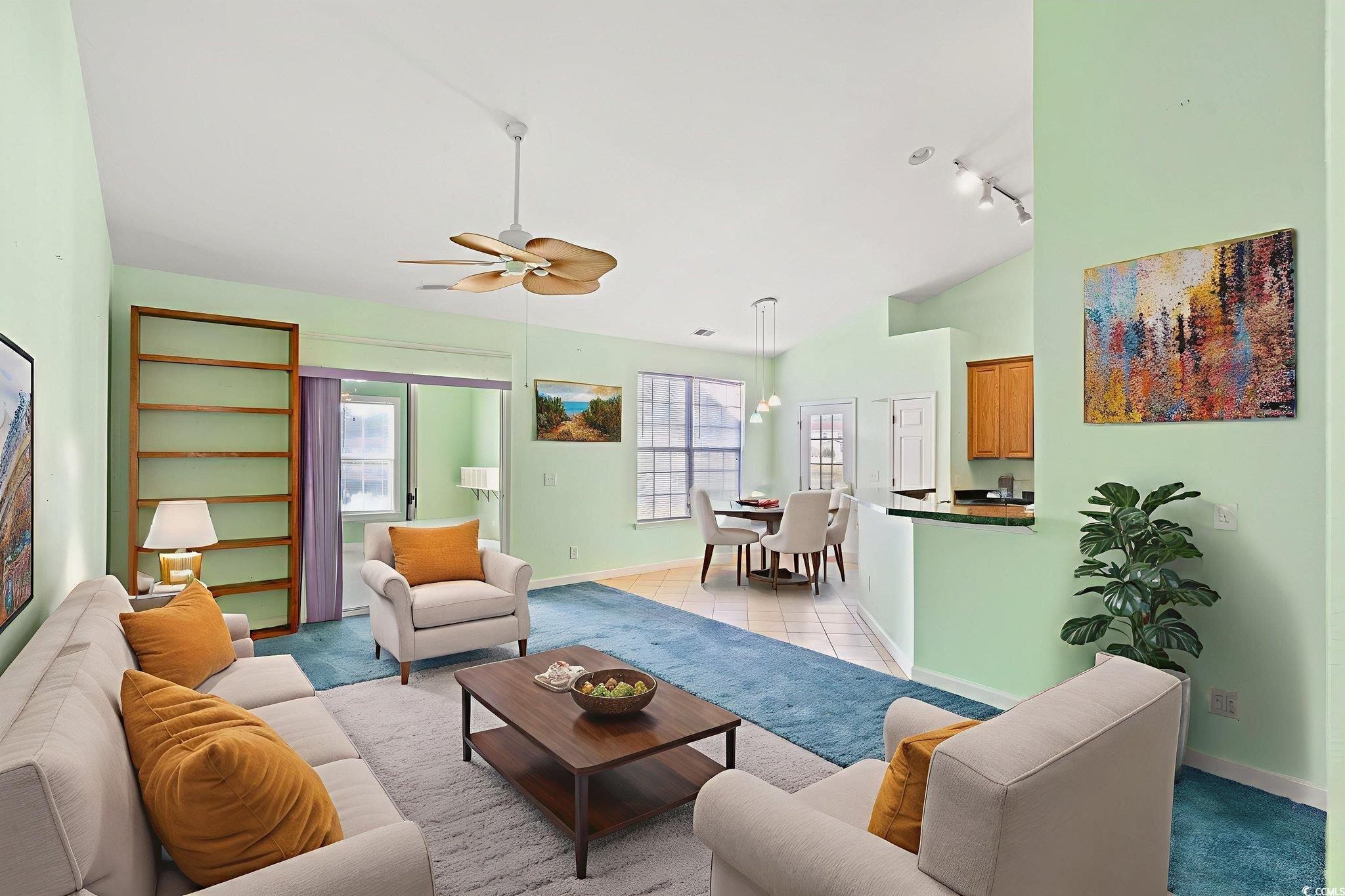 875 Brookline Drive Myrtle Beach, SC 29579 - Photo 7 of 40 Living room with ceiling fan, tile patterned flooring, carpet floors, and high vaulted ceiling
