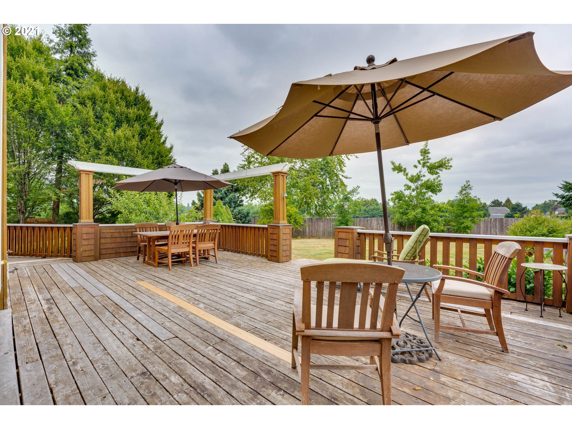 27603 Northeast 10th Avenue Ridgefield, WA 98642 - Photo 17 of 32 a view of chairs and tables in the back yard
