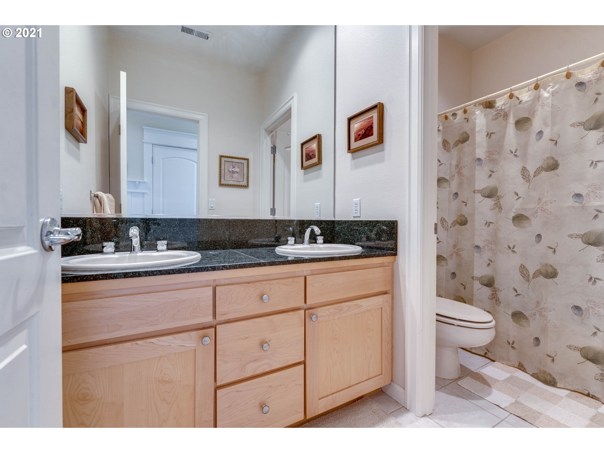 27603 Northeast 10th Avenue Ridgefield, WA 98642 - Photo 23 of 32 a bathroom with a granite countertop sink toilet and mirror