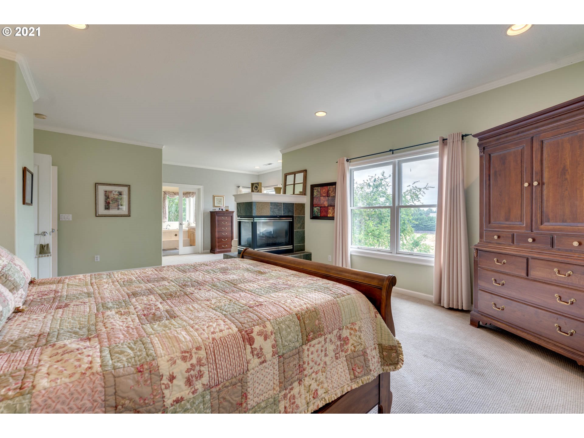 27603 Northeast 10th Avenue Ridgefield, WA 98642 - Photo 26 of 32 a spacious bedroom with a large bed and a dresser