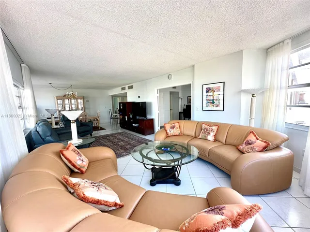 a bedroom with a bed and a mirror on dresser