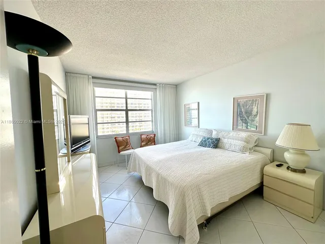 a view of a swimming pool with a table and chairs