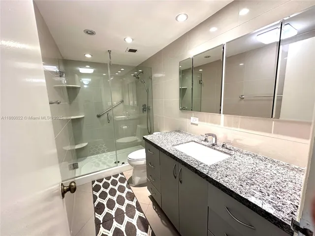 a green field with lots of palm trees