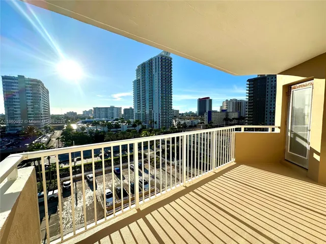 a living room with pool table and chairs