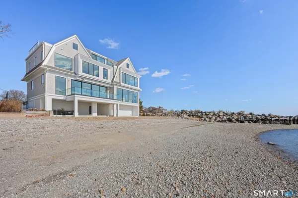 a view of an ocean with a building in the background