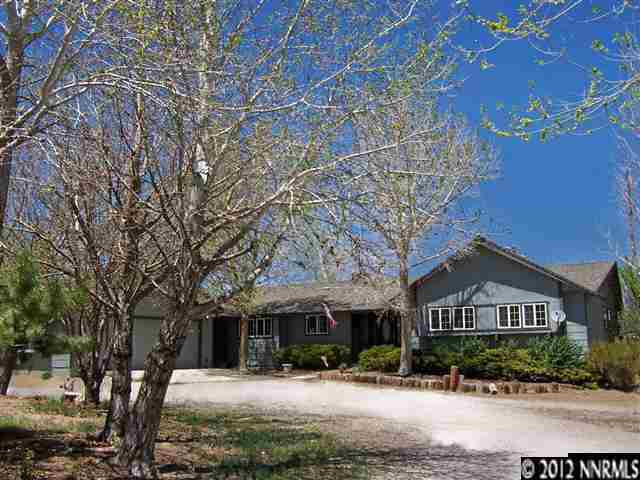 10815 Santa Fe Road Reno, NV 89508 - Photo 1 of 1 a front view of a house with a yard