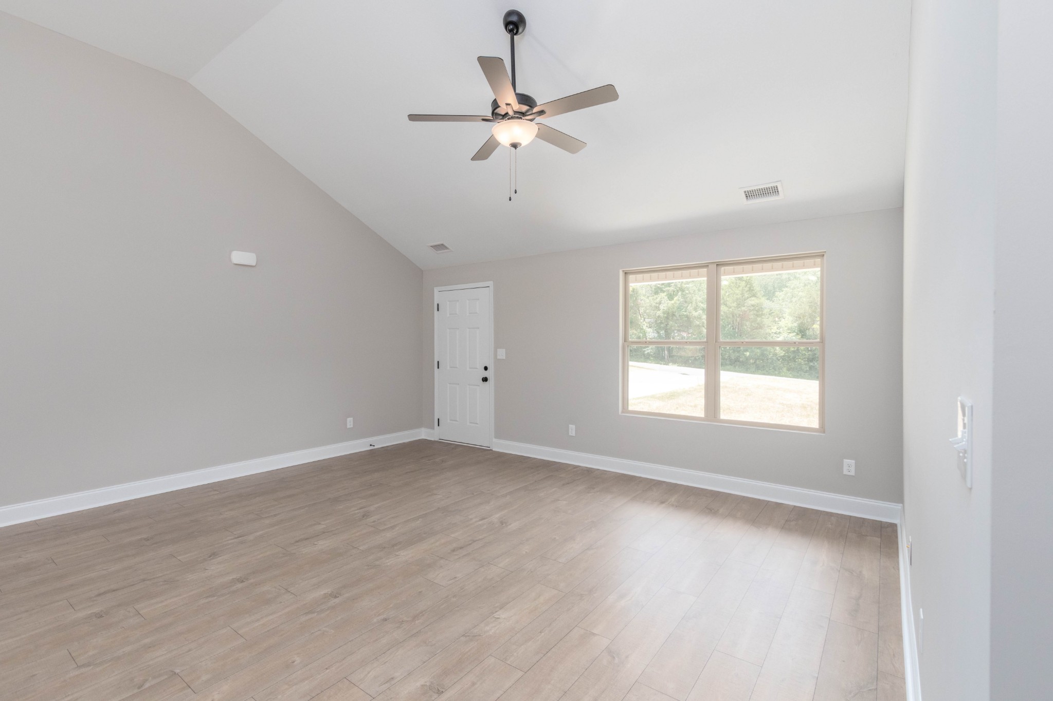 301 Old Columbia Road Dickson, TN 37055 - Photo 12 of 22 wooden floor in an empty room with a window