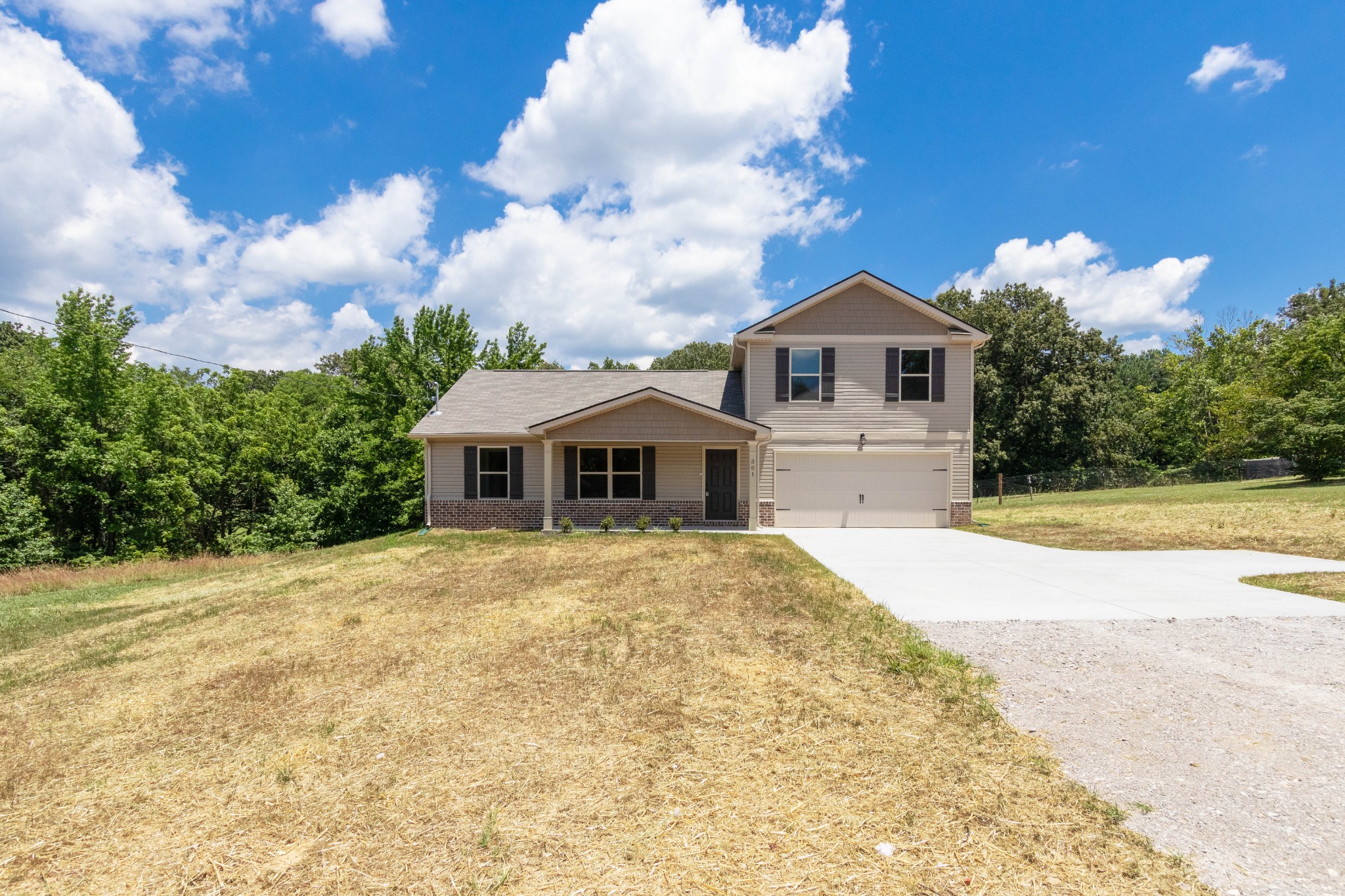 301 Old Columbia Road Dickson, TN 37055 - Photo 2 of 22 a front view of a house with a yard