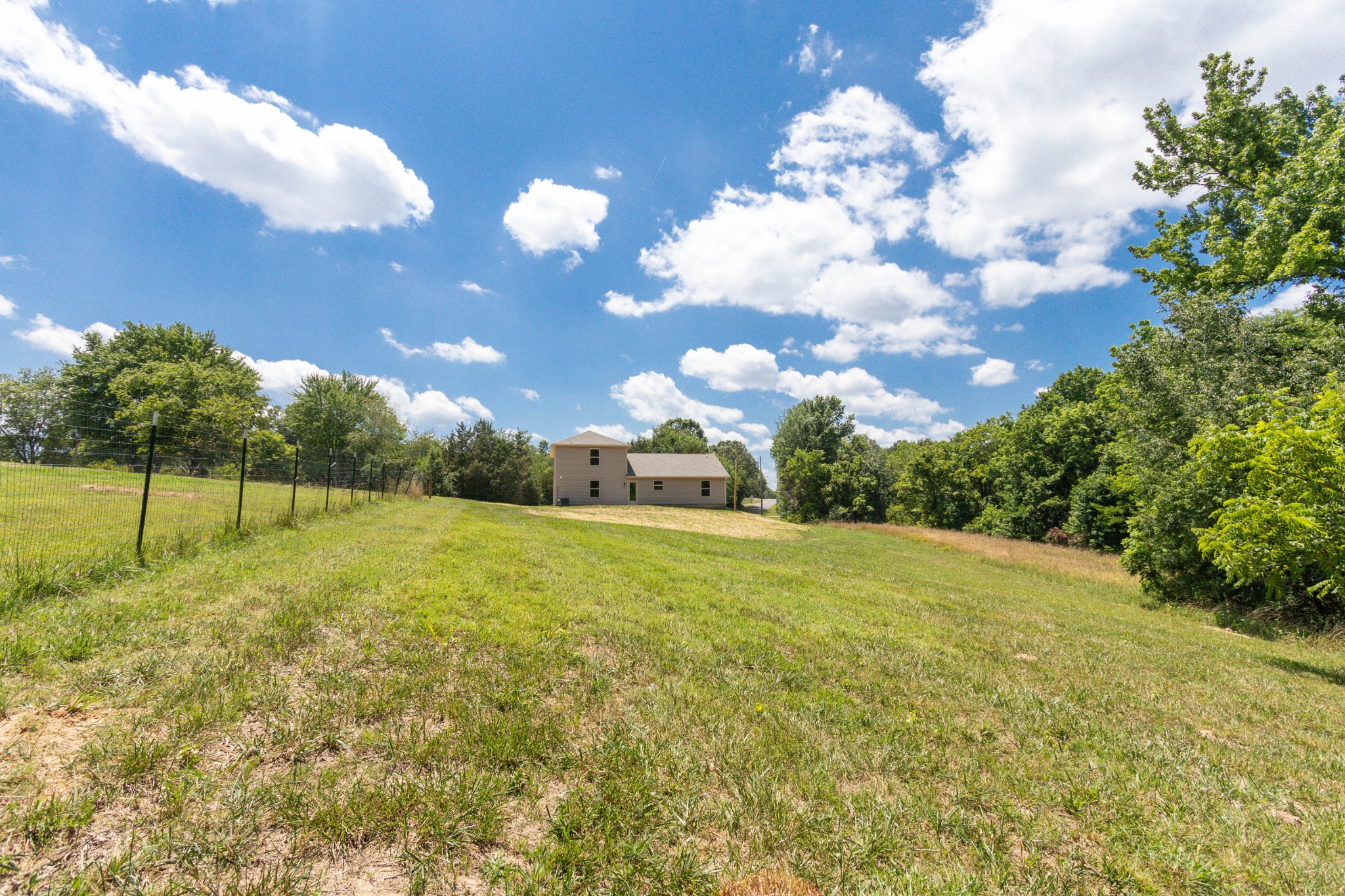 301 Old Columbia Road Dickson, TN 37055 - Photo 6 of 22 a house view with swimming pool and trees in the background