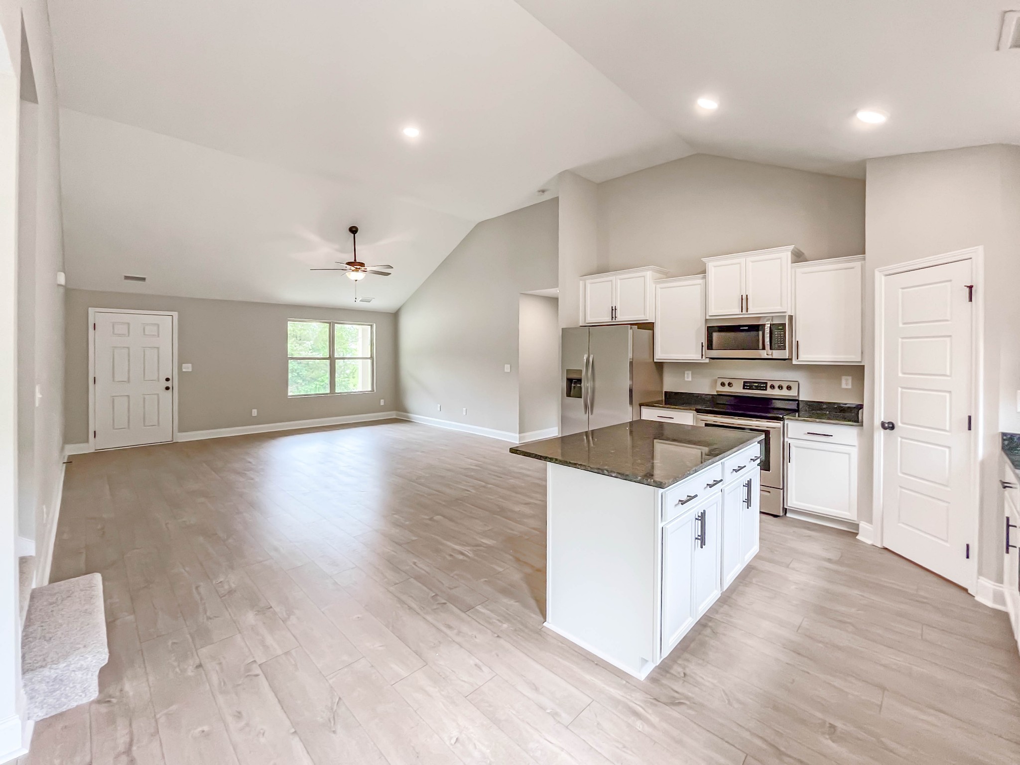 301 Old Columbia Road Dickson, TN 37055 - Photo 10 of 22 a kitchen with granite countertop a stove top oven and cabinets
