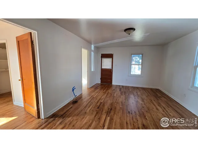 a bathroom with a sink a mirror and a window