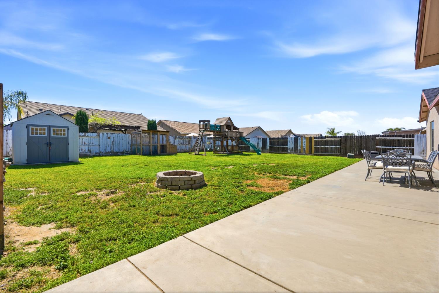1849 West Spring Crest Street Hanford, CA 93230 - Photo 39 of 45 a view of a garden with a slide