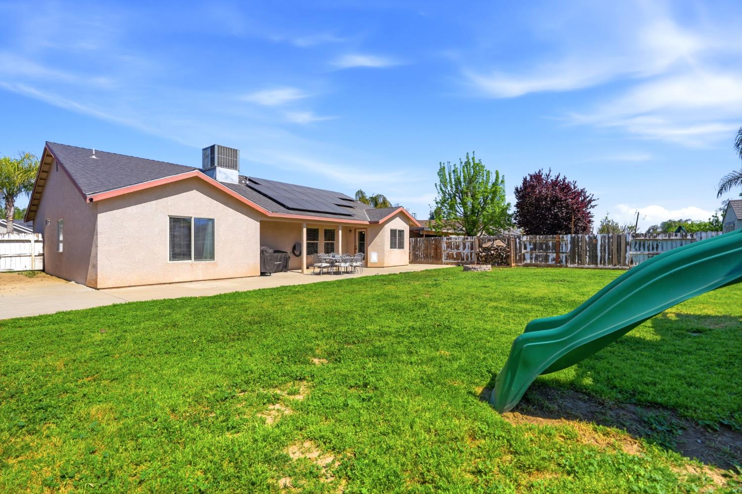 1849 West Spring Crest Street Hanford, CA 93230 - Photo 43 of 45 a front view of a house with garden