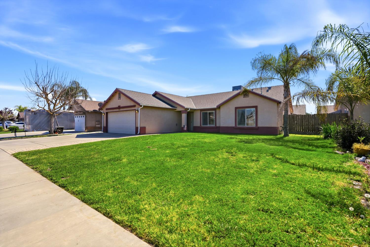 1849 West Spring Crest Street Hanford, CA 93230 - Photo 5 of 45 a view of a house with a big yard