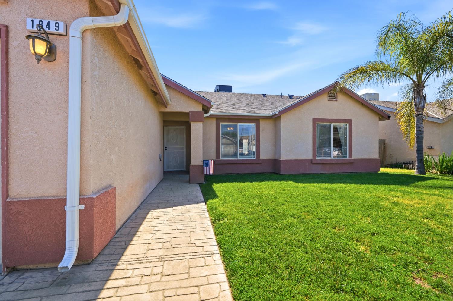 1849 West Spring Crest Street Hanford, CA 93230 - Photo 6 of 45 a view of outdoor space yard and front view of a house