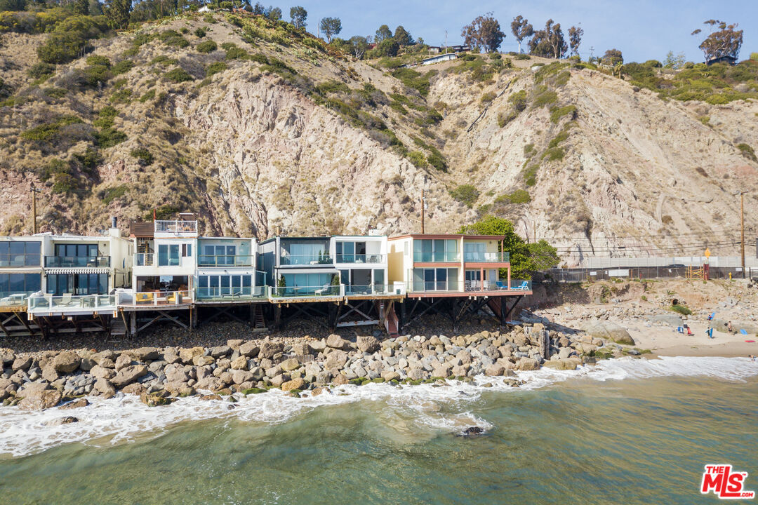 20520 Pacific Coast Highway Malibu, CA 90265 - Photo 25 of 27 a front view of a house with a yard